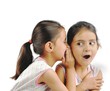 Two Indian kids gossiping about something.