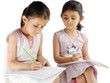 Two Indian kids studying at home.