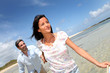 Cheerful couple walking by the sea