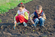 Two little children weed beds Two little children weed beds