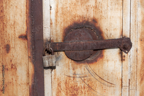 Photo: Close up of a rusty vintage padlock Close up of a rusty vintage padlock