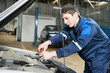 auto mechanic at work with wrench auto mechanic at work with wrench