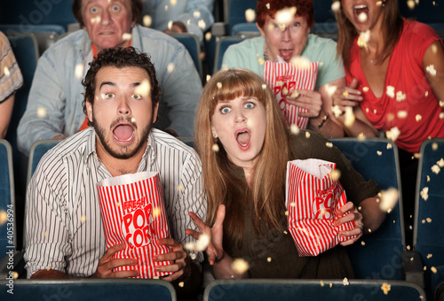 Photo: Scared People Tossing Popcorn Scared People Tossing Popcorn