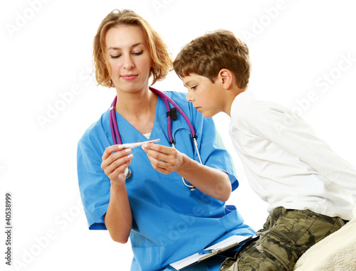 Photo: A female doctor is measuring boy's temperature A female doctor is measuring boy's temperature
