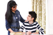 Photo: Student getting guidance from helpful teacher Student getting guidance from helpful teacher
