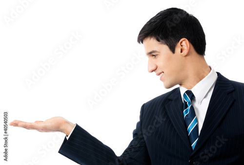 Photo: Business man showing, isolated Business man showing, isolated