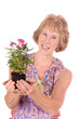 woman gardener holding plant