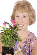 woman gardener holding plant