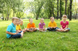 Group of children sitting together in the park