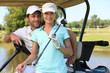 Couple in golf car