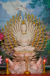 Ancient sculpture of a buddha with four faces and eight hands