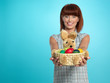Photo: attractive young woman holding easter eggs basket attractive young woman holding easter eggs basket