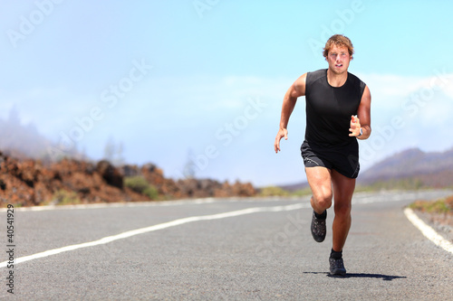 Photo: Man running / sprinting on road Man running / sprinting on road