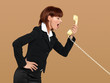 Photo: attractive, young businesswoman screaming into the telephone attractive, young businesswoman screaming into the telephone