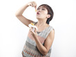 Chinese Asian Lady snacking on her meal