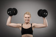 Athletic young lady working out with weights Athletic young lady working out with weights