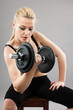 Athletic young lady working out with weights Athletic young lady working out with weights