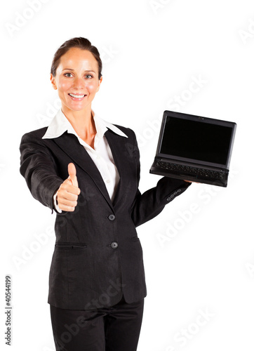 Photo: businesswoman holding laptop and giving thumb up businesswoman holding laptop and giving thumb up