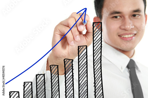 Photo: Businessman drawing a rising diagram Businessman drawing a rising diagram