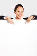 businesswoman pointing at white board