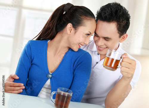 Photo: young couple having a tea young couple having a tea