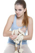 young woman with tied up hands over white