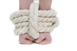 tied up female hands over white
