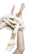 female hands tied up with rope over white