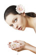 natural beauty portrait woman with flower in the hands