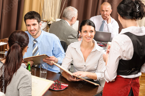 Photo: Business lunch waitress take order meal restaurant Business lunch waitress take order meal restaurant