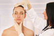 Cosmetic medicine, a doctor is examining patient's face