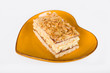 Nut cake on a heart shaped plate