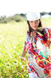 Beautiful gypsy girl with scarf standing in meadow Beautiful gypsy girl with scarf standing in meadow