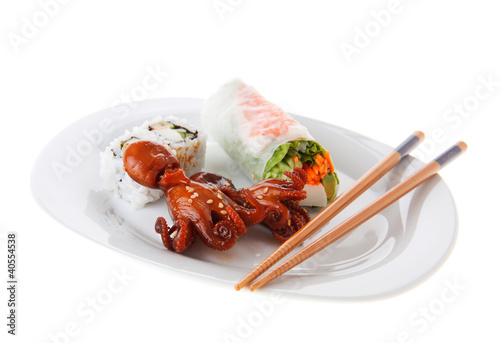 Photo: Baby octopus, sushi and spring roll on a plate Baby octopus, sushi and spring roll on a plate