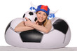 Photo: Happy football cheerleader with ball Happy football cheerleader with ball
