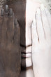 woman in the two-color makeup covers eyes woman in the two-color makeup covers eyes