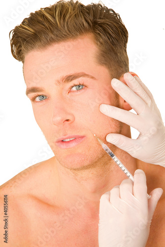 Photo: young man doing botox injections young man doing botox injections