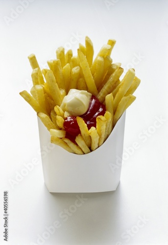 Photo: Chips with ketchup and mayo in white fast food box Chips with ketchup and mayo in white fast food box