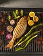 A Whole Snapper on the Grill with Lemons, Onions and Jalapenos