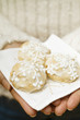 Hands holding Elisen gingerbread on napkin
