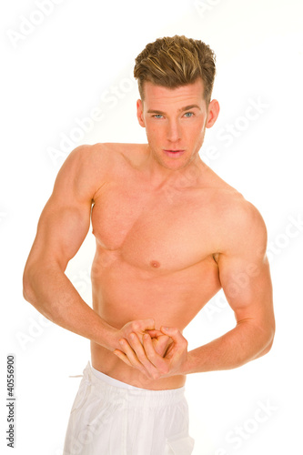 Photo: bare-chested man showing muscles bare-chested man showing muscles