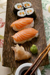 Nigiri-sushi and maki-sushi with ginger, soy sauce, wasabi