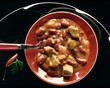 Photo: Chili con carne on red plate Chili con carne on red plate