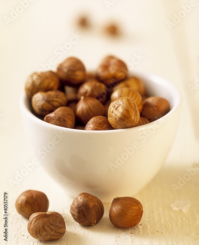 Photo: Hazelnut kernels in small white bowl Hazelnut kernels in small white bowl