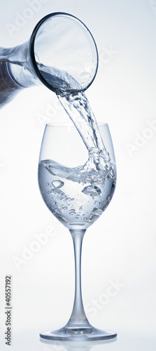 Photo: Pouring water into glass from carafe Pouring water into glass from carafe