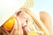 Photo: young blond girl with orange juice young blond girl with orange juice