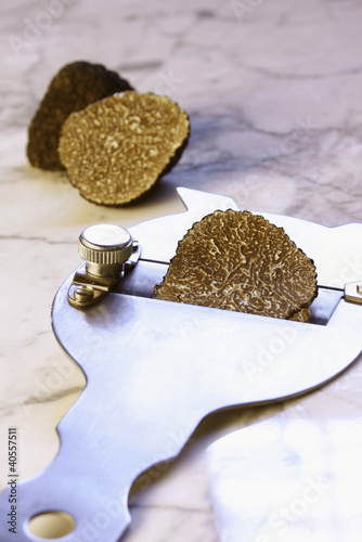 Photo: Black truffle with truffle slicer Black truffle with truffle slicer
