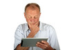 Concentrated man looking at his tablet computerd