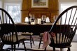 Laid table with red wine in front of fireplace