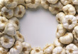 Dried garlic laid around the edge of the picture